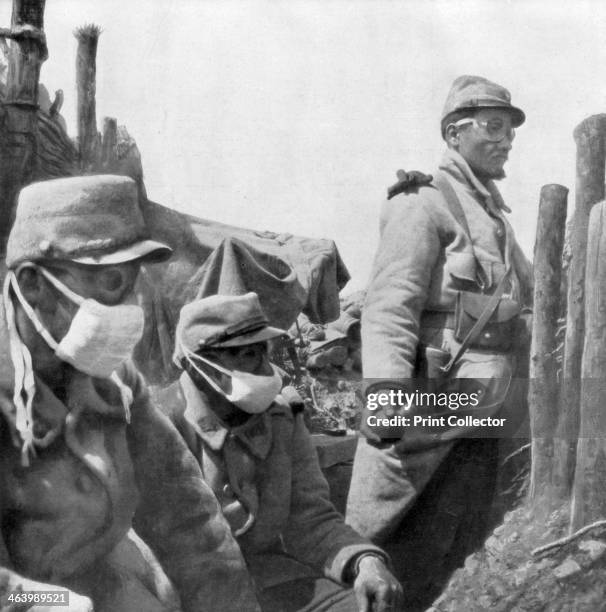 Gas protection, France, World War I, 1915. French troops in a trench wearing rudimentary facemasks and goggles. On 22 April 1915 the Germans released...