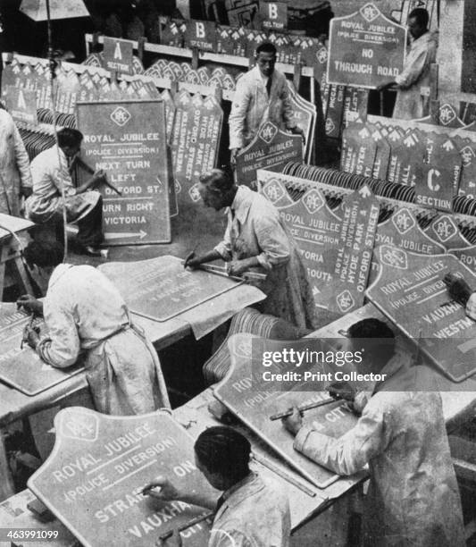 Men in the RAC Highways Department preparing traffic signs, 1935. The signs were being prepared as part of King George V's silver jubilee...