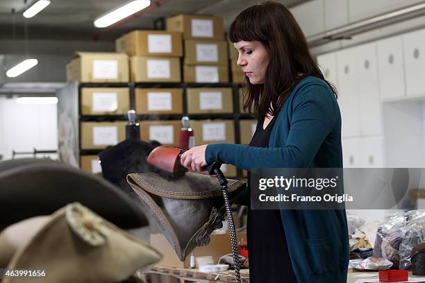 Girl irons hats at the Tirelli deposit of Formello on February 20, 2015 in Rome, Italy. The costumier Tirelli was established in 1964 and is...