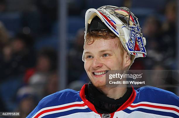 Mackenzie Skapski of the New York Rangers, playing in his first NHL game, flashes a smile during their game against the Buffalo Sabres on February...