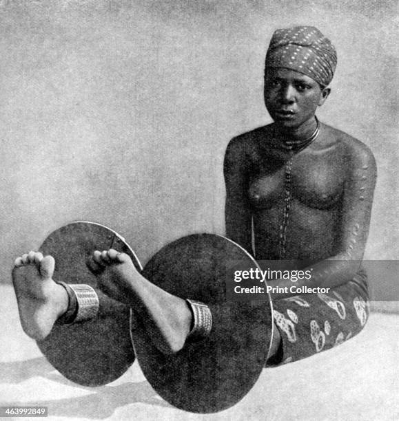 An Igbo woman wearing ankle plates, Nigeria, West Africa, 1922. From Peoples of All Nations, Their Life Today and the Story of Their Past, volume I:...