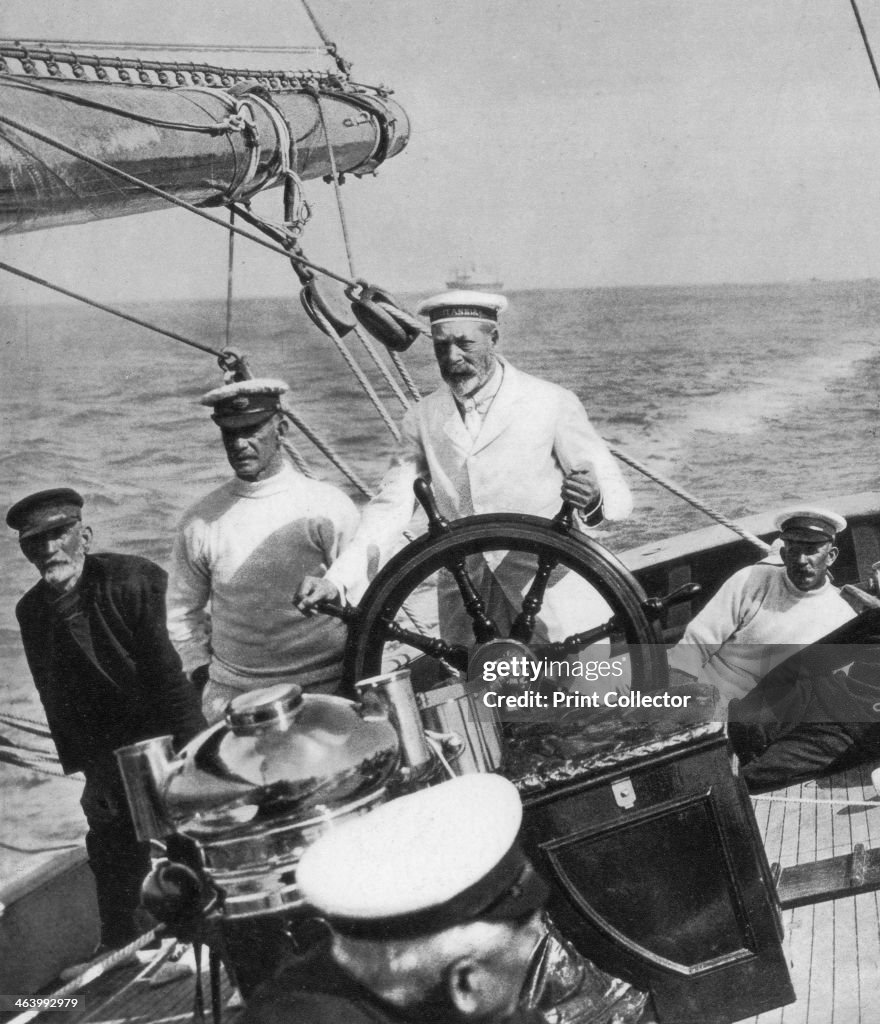 King George V at the helm of his yacht Britannia, c1930s.