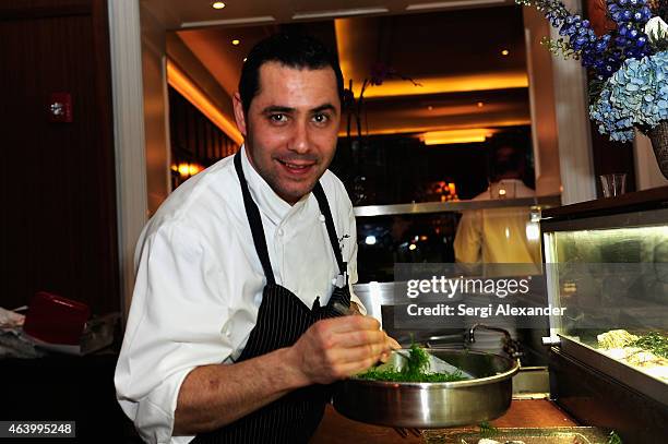 Chef Israel Mora prepares food at Oyster Bash presented by Island Creek Oysters hosted by Ming Tsai, Josh Capon and Jeremy Sewall during the 2015...