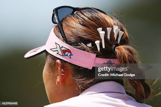 Lydia Ko of New Zealand puts tees in her hair to use later during day three of the LPGA Australian Open at Royal Melbourne Golf Course on February...