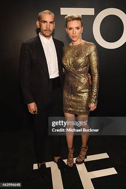 Journalist Romain Dauriac and actress Scarlett Johansson, both wearing TOM FORD, attend the TOM FORD Autumn/Winter 2015 Womenswear Collection...