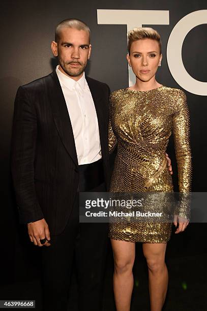 Journalist Romain Dauriac and actress Scarlett Johansson, both wearing TOM FORD, attend the TOM FORD Autumn/Winter 2015 Womenswear Collection...