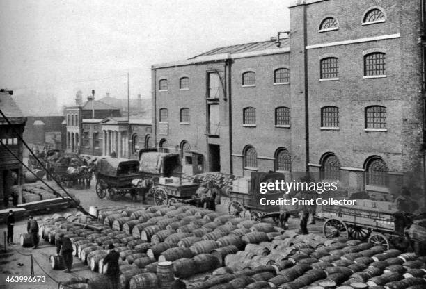 Barrels of molasses, West India Docks, London, 1926-1927. Illustration from Wonderful London, edited by Arthur St John Adcock, Volume I, published by...