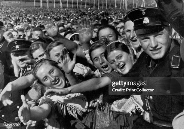 'The German farmers salute their Führer', Bückeberg, Germany, 1935. A print from Adolf Hitler. Bilder aus dem Leben des Führers, Hamburg:...