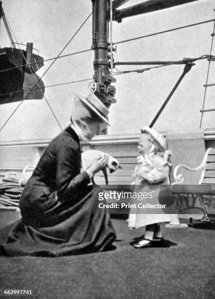Princess Victoria with Prince Olav , the future King Olav V of Norway, 1908. From Queen Alexandra's Christmas Gift Book, Photographs from My Camera,...