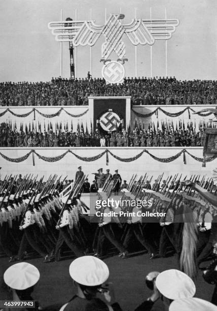 Review of the armed forces, Nuremberg, Germany, 1935. Sailors marching past the Nazi leadership. A print from Adolf Hitler. Bilder aus dem Leben des...