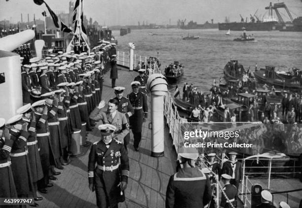 Adolf Hitler reviewing the battleship SMS 'Schleswig-Holstein', Hamburg, Germany, 1936. Hitler acknowledging the salutes of the crew. The...