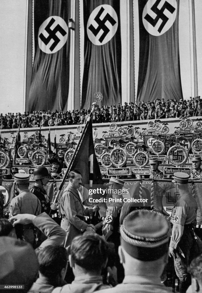 Adolf Hitler dedicates new standards, Nuremberg Rally, Germany, 1934 ...
