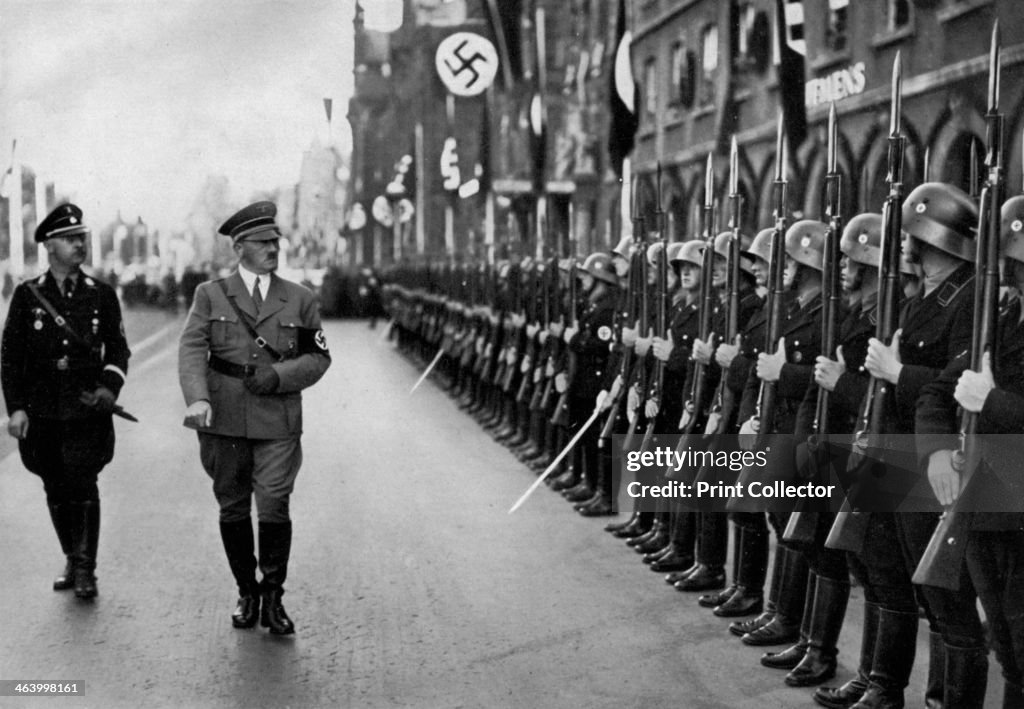 Adolf Hitler reviewing Leibstandarte troops at the Nuremberg Rally, Germany, 1935.