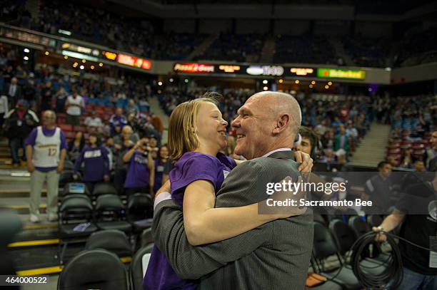 Sacramento Kings head coach George Karl embraces his daughter, Kaci, after receiving a standing ovation as he entered the the arena before the Kings...