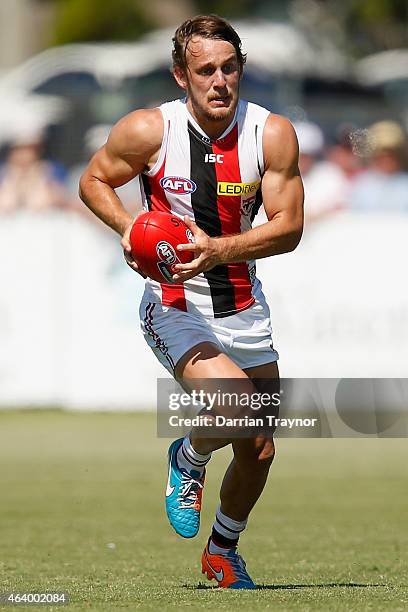 Josh Saunders runs with the ball during the St Kilda Saints AFL intra club match at Linen House Oval on February 21, 2015 in Melbourne, Australia.