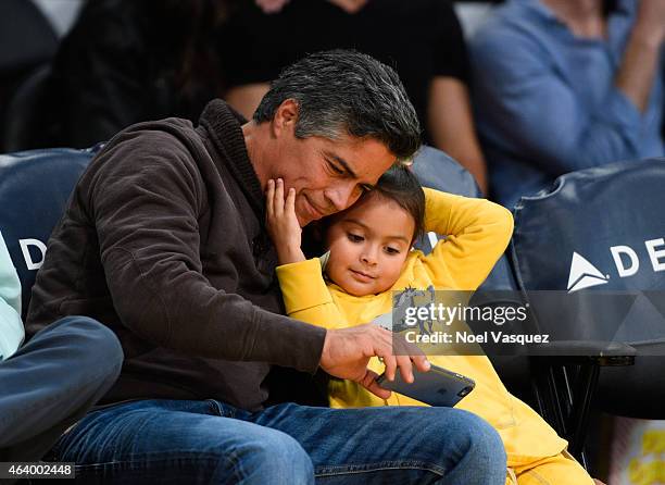 Esai Morales and his daughter Mariana Oliveira Morales attend a basketball game between the Brooklyn Nets and the Los Angeles Lakers at Staples...