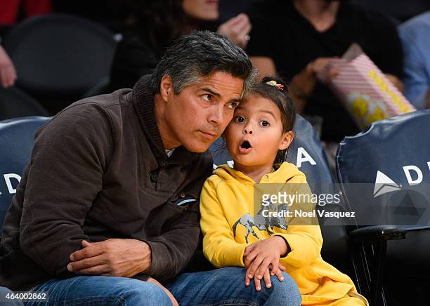 Esai Morales and his daughter Mariana Oliveira Morales attend a basketball game between the Brooklyn Nets and the Los Angeles Lakers at Staples...