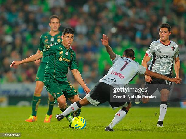 Luis Mendoza of Santos tries to dribble Edgar Castillo of Atlas during a match between Santos Laguna and Atlas as part of 7th round Clausura 2015...