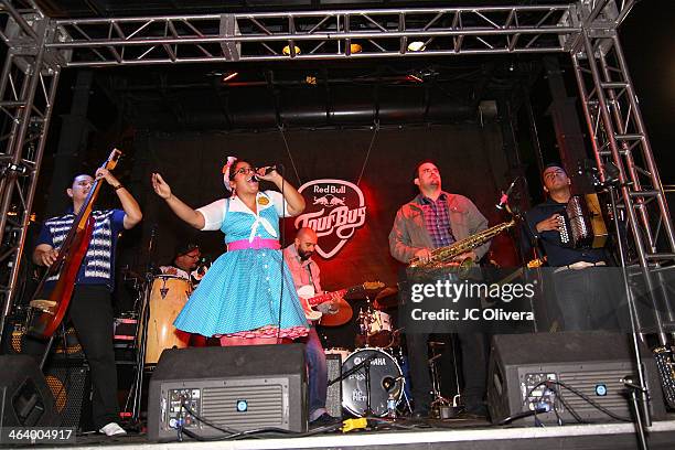 La Santa Cecilia perform on stage with special guests Raul Pacheco and Ulises Bella of Ozomatli at Olvera Street on January 19, 2014 in Los Angeles,...