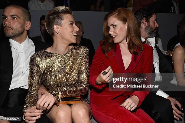 Journalist Romain Dauriac, actress Scarlett Johansson, and actress Amy Adams, all wearing TOM FORD, attend the TOM FORD Autumn/Winter 2015 Womenswear...