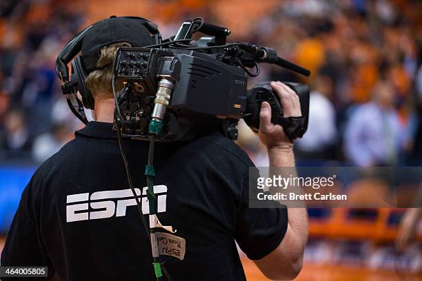 Cameraman working for ESPN network operates a camera at court side before a game between the Syracuse Orange and the North Carolina Tar Heels on...