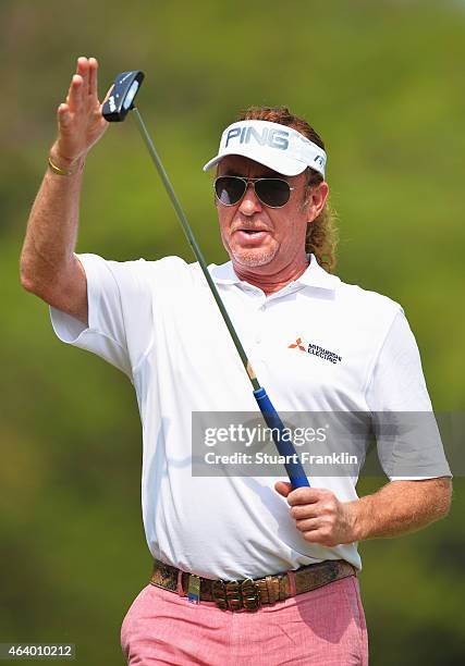 Miguel Angel Jimenez of Spain celebrates a putt by pushing his putter as though he was replacing a sword in it holster during the third round of the...