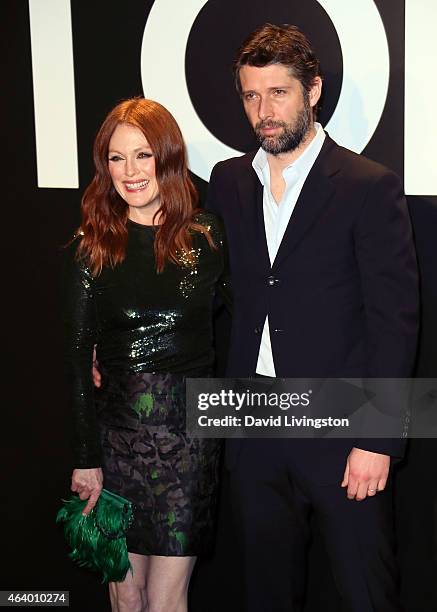 Actress Julianne Moore and husband director Bart Freundlich attend the Tom Ford Autumn/Winter 2015 Womenswear Collection presentation at Milk Studios...