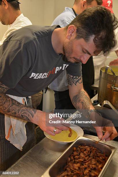 Chef Gabriele Corcos prepares food at the Tuscan Trio Dinner hosted by Fabio Viviani, Debi Mazar and Gabriele Corcos during the 2015 Food Network &...