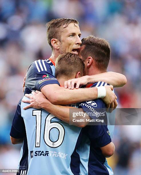 Marc Janko of Sydney FC celebrates with Alex Gersbach and Shane Smeltz after scoring a goal during the round 18 A-League match between Sydney FC and...