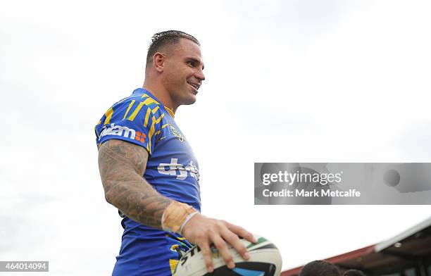 Anthony Watmough of the Eels laughs with team mates on the bench during the NRL Trial Match between the Penrith Panthers and the Parramatta Eels at...