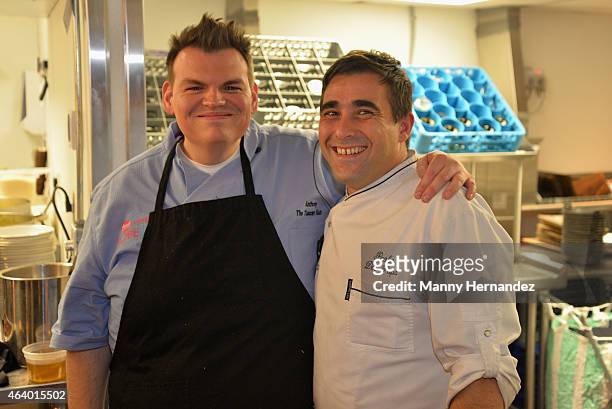 Chefs pose in the kitchen at the Tuscan Trio Dinner hosted by Fabio Viviani, Debi Mazar and Gabriele Corcos during the 2015 Food Network & Cooking...