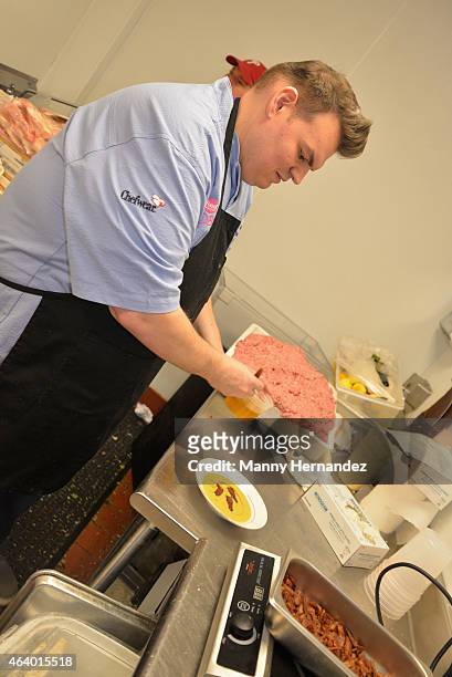 Chef prepares food backstage at the Tuscan Trio Dinner hosted by Fabio Viviani, Debi Mazar and Gabriele Corcos during the 2015 Food Network & Cooking...