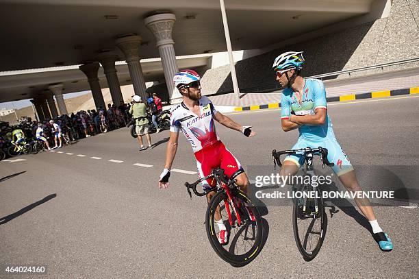 Italians Vincezo Nibali and Luca Paolini speak together ahead of the fifth stage in the Tour of Oman, on February 21 to negotiate the cancellation of...