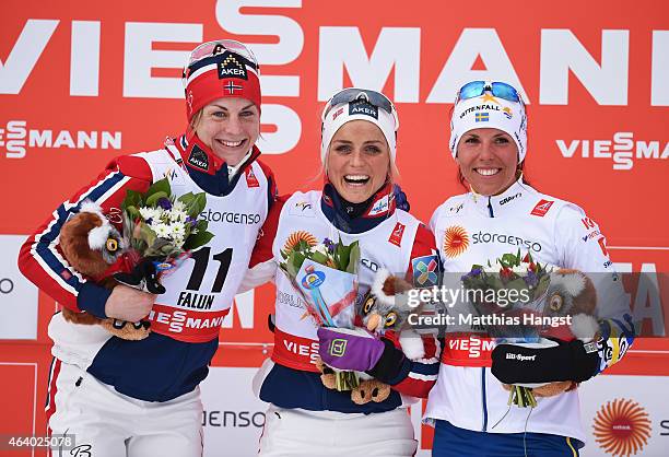 Gold medallist Therese Johaug of Norway celebrates with silver medallist Astrid Uhrenholdt Jacobsen of Norway and bronze medallist Charlotte Kalla of...