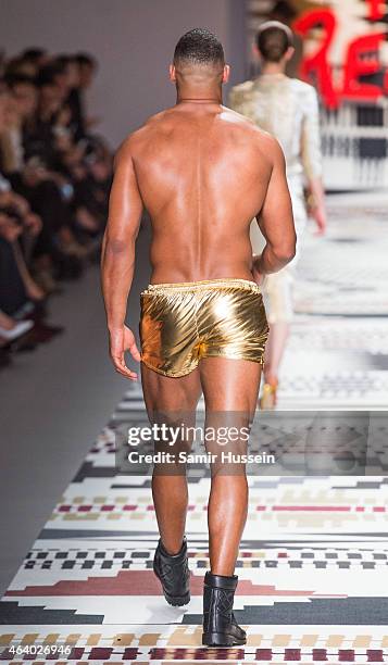 Model walks the runway at the Fashion For Relief charity fashion show to kick off London Fashion Week Fall/Winter 2015/16 at Somerset House on...