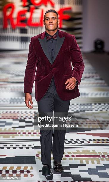 Model walks the runway at the Fashion For Relief charity fashion show to kick off London Fashion Week Fall/Winter 2015/16 at Somerset House on...