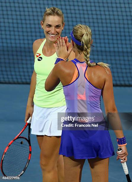 Timea Babos of Hungary and Kristina Mladenovic of France celebrate defeating Garbine Muguruza of Spain and Carla Suarez Navarro of Spain during their...