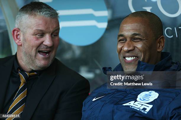 Director of football Les Ferdinand in discussion with ex-Hull City player Dean Windass prior to the Barclays Premier League match between Hull City...