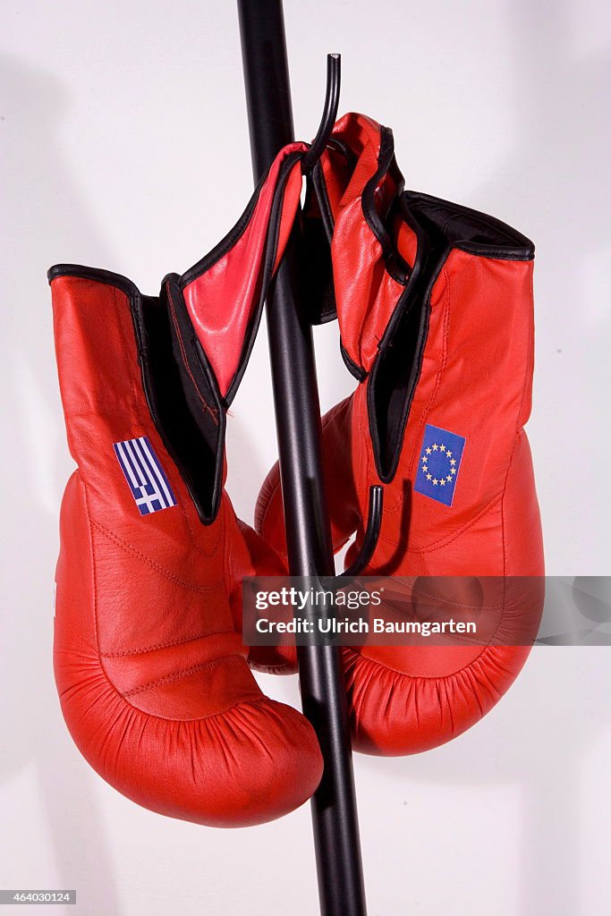 Boxing Gloves With Flags EU And Greece On A Coat Hook.