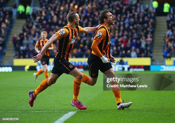 Nikica Jelevic of Hull City celebrates with David Meyler as he scores their first goal during the Barclays Premier League match between Hull City and...