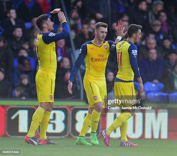 Olivier Giroud of Arsenal celebrates with Calum Chambers and Mesut Oezil as he scores their second goal during the Barclays Premier League match...