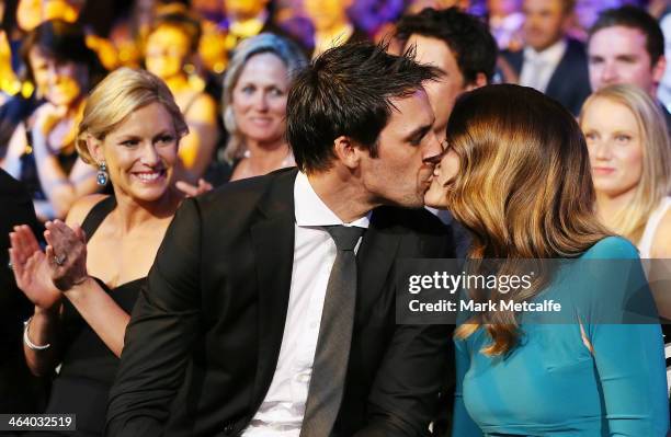 Mitchell Johnson is kissed by his wife Jessica Bratich-Johnson after winning the Allan Border Medal during the 2014 Allan Border Medal at Doltone...