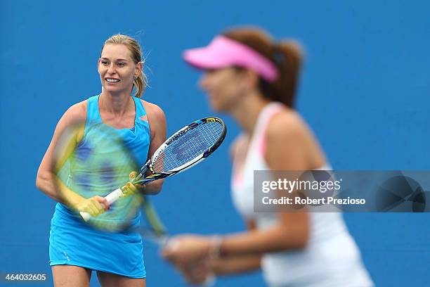 Barbara Schett of Austria and Iva Majoli of Croatia in action in their Women's Legends' Doubles match against Tracy Austin and Mary Joe Fernandez of...