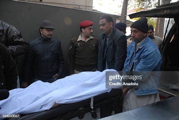 Pakistan, Rawalpindi: Dead bodies being carried to a morgue after a suicide bomb attack killed 13 people on January 20 in Rawalpindi, Pakistan. Bomb...