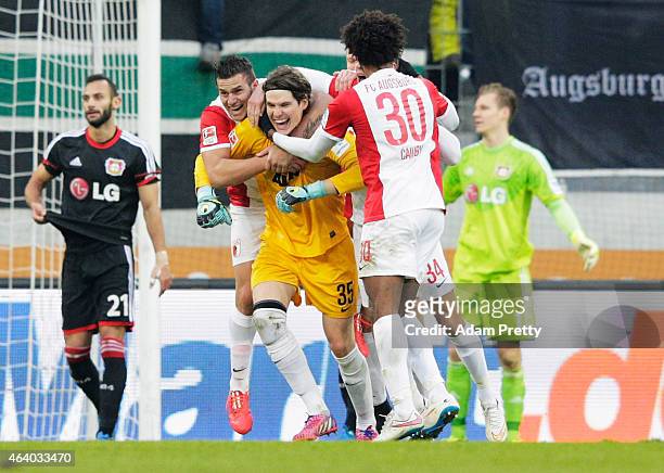 Marwin Hitz Goalkeeper of Augsburg scores a goal during the Bundesliga match between FC Augsburg and Bayer 04 Leverkusen at SGL Arena on February 21,...