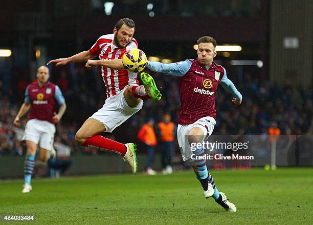 Erik Pieters of Stoke City and Andreas Weimann of Aston Villa battle for the ball during the Barclays Premier League match between Aston Villa and...