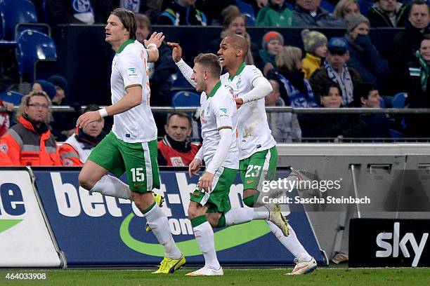 Sebastian Proedl of Bremen celebrates with team mates after scoring his team's first goal during the Bundesliga match between FC Schalke 04 and SV...