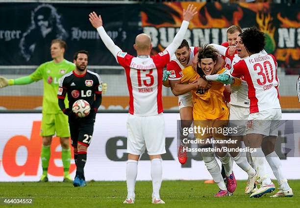 Marwin Hitz, keeper of Augsburg celebrates scoring the 2nd team goal with his team mates during the Bundesliga match between FC Augsburg and Bayer 04...