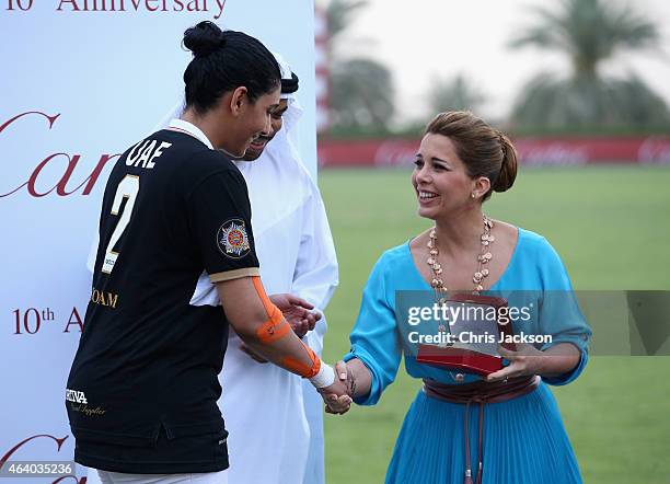 Princess Haya Bint Al Hussein presents a watch to HH Sheikha Maitha during the presentations on the final day of the Cartier International Dubai Polo...