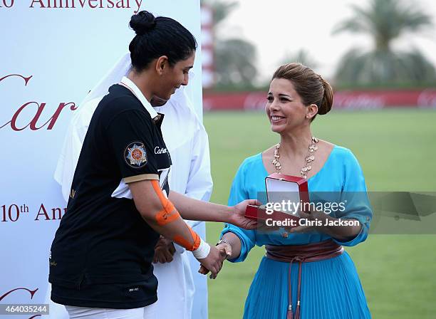 Princess Haya Bint Al Hussein presents a watch to HH Sheikha Maitha during the presentations on the final day of the Cartier International Dubai Polo...